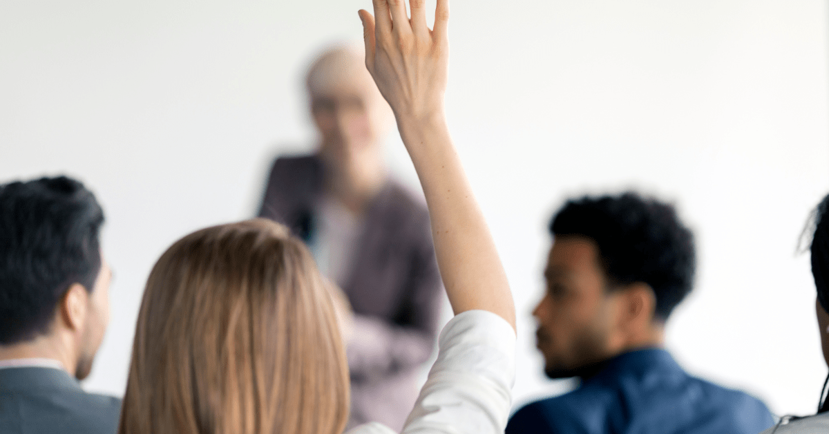 questions Woman raising her hand.