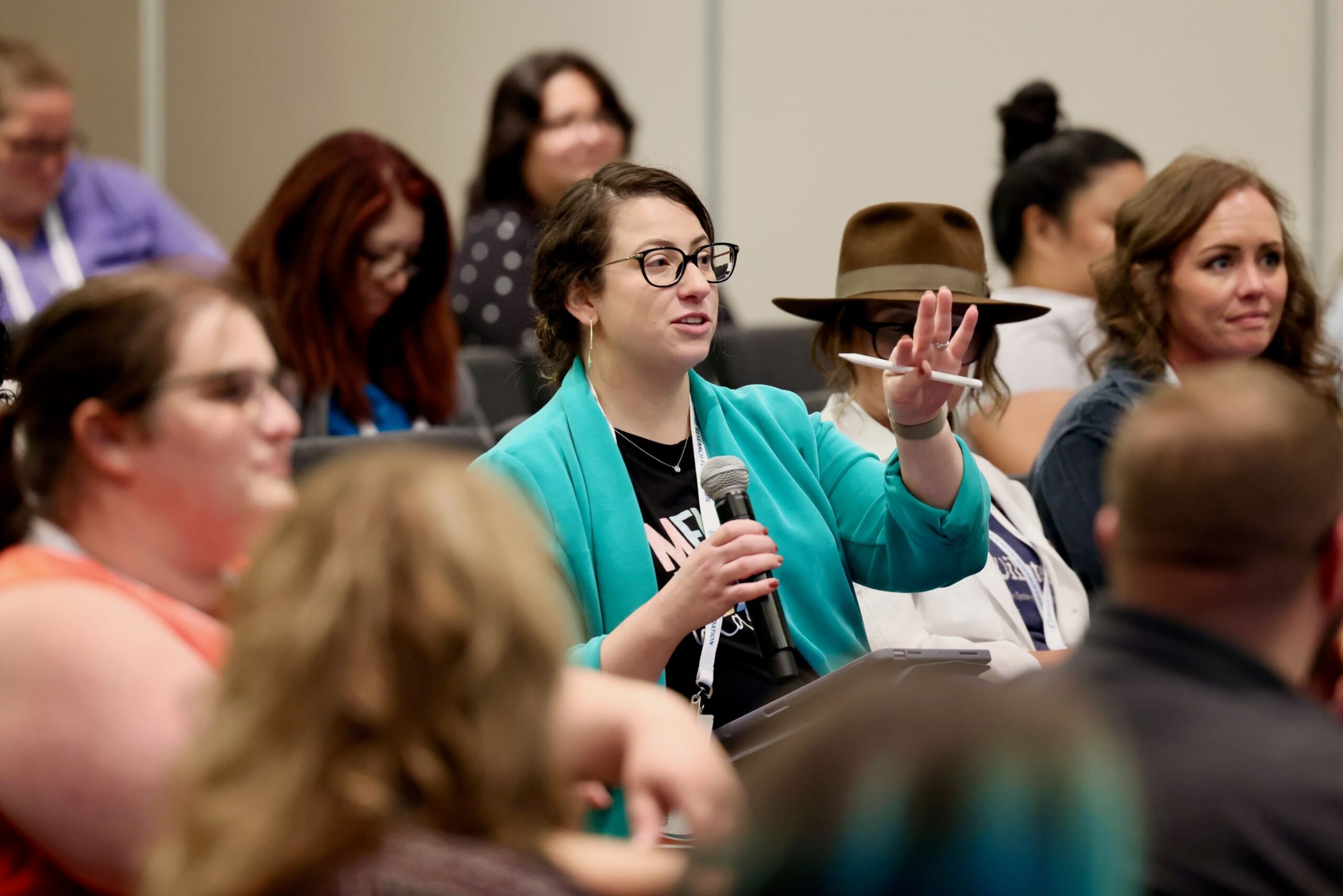 2025EMDRIAConferenceAttendeeParticipation Woman participating in conversation during 2025 EMDRIA Conference